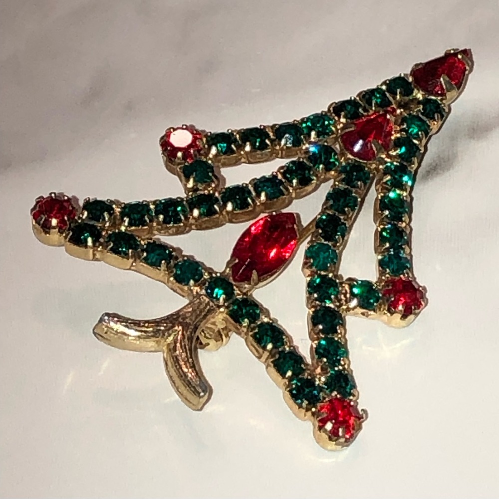 Gold tone Christmas tree brooch with red & green prong set rhinestones